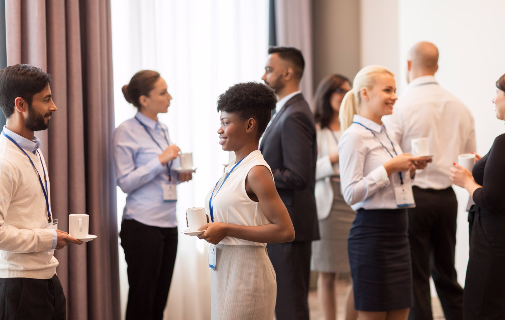 People talking at a busy networking event